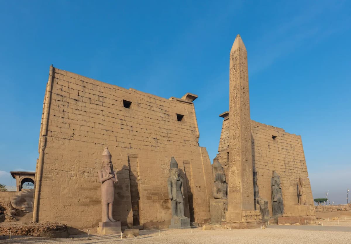 The colonnaded forecourt of Luxor Temple illuminated at night, Luxor, Egypt