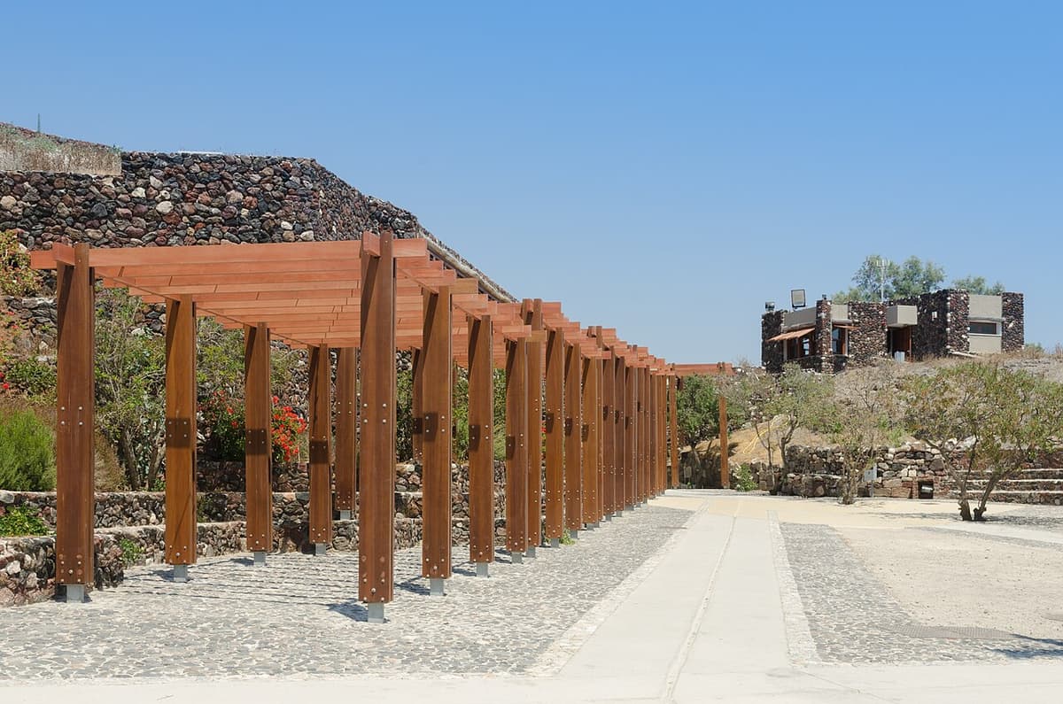 Excavated streets and multi-storey buildings of the Bronze Age town of Akrotiri, Santorini