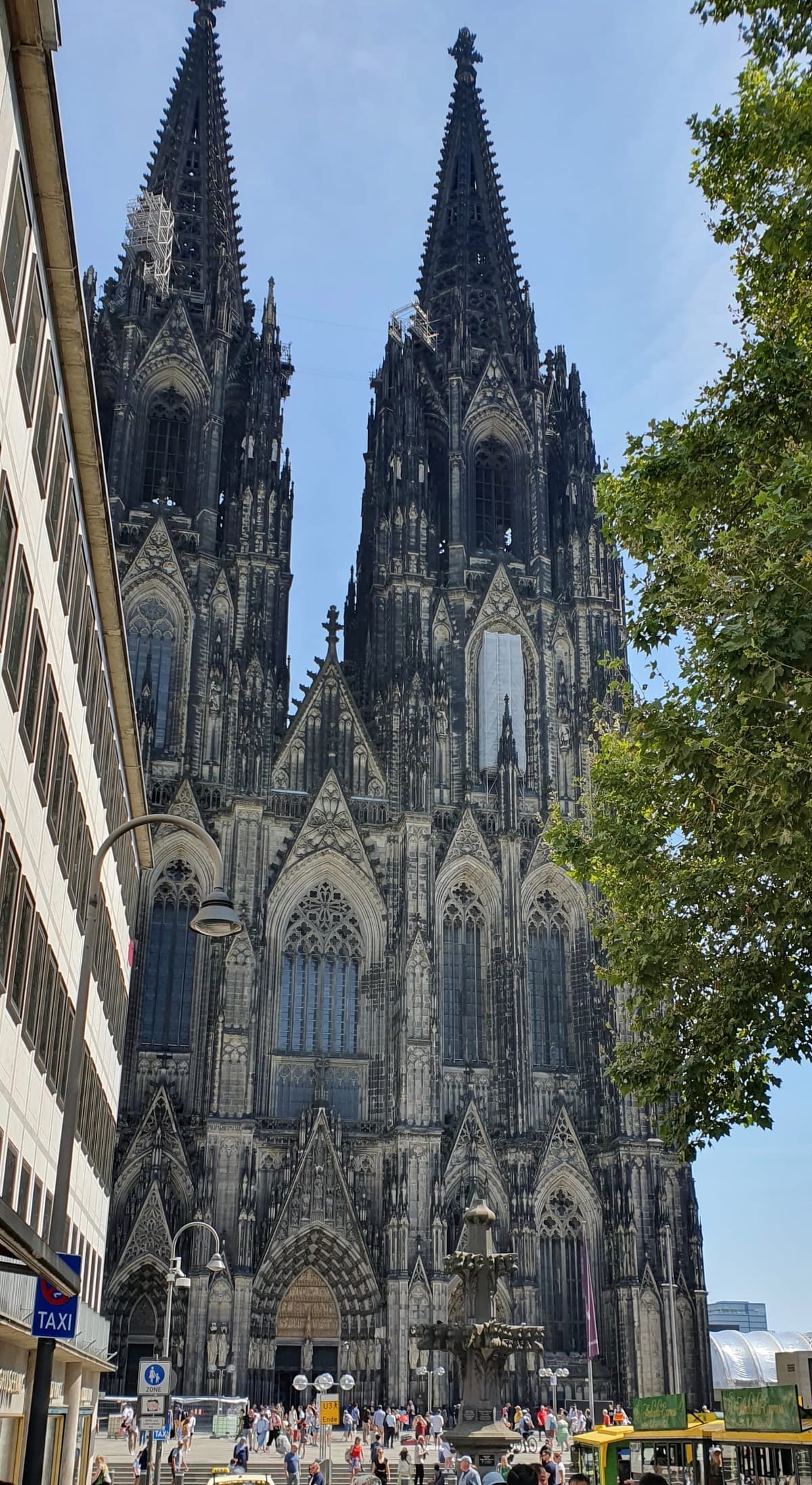West façade of Cologne Cathedral under a clear sky