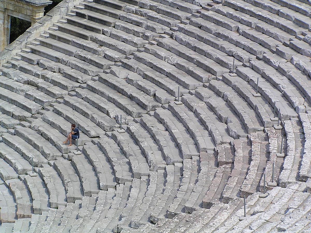 The ancient theatre of Epidaurus in the Peloponnese, Greece, with its perfectly preserved limestone seating
