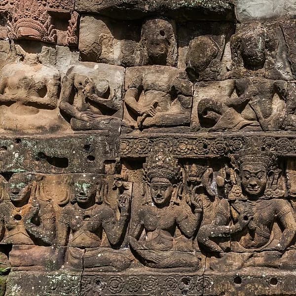 Giant carved stone faces on the towers of the Bayon Temple at the centre of Angkor Thom, Cambodia