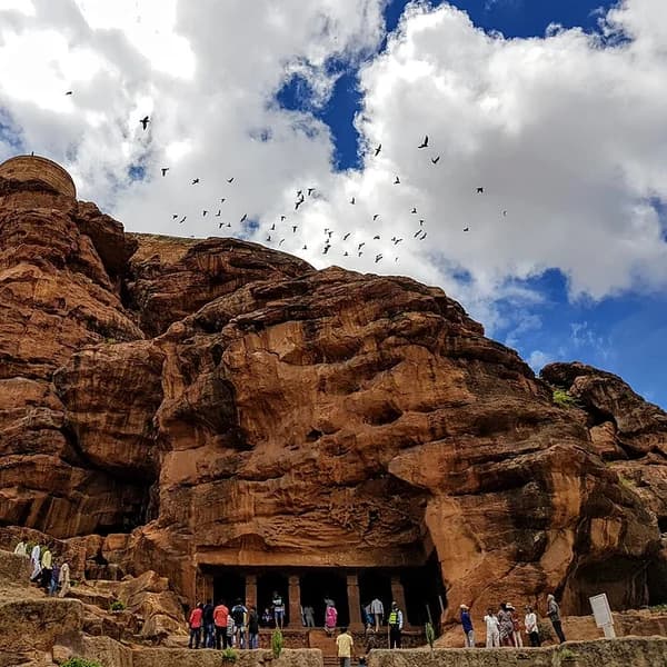 Sandstone cave temples in the cliff above Agastya Lake at Badami, Karnataka