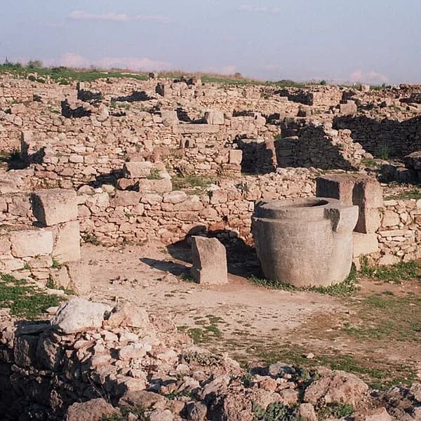 Stone foundations and walls of the archaeological site of Ugarit at Ras Shamra