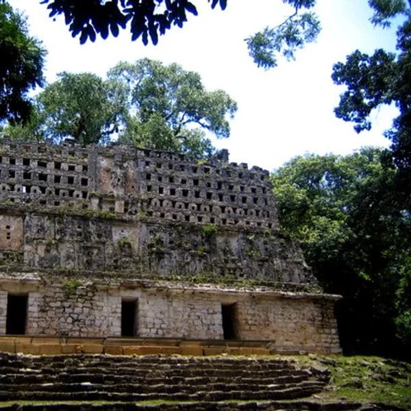 Temple 33 with roof comb rising above the jungle at Yaxchilan, Chiapas, Mexico
