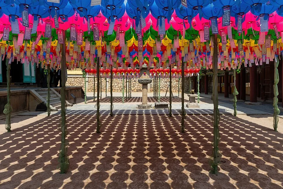 Courtyard of colorful paper lanterns and shadow patterns at Bulguksa temple Gyeongju South Korea