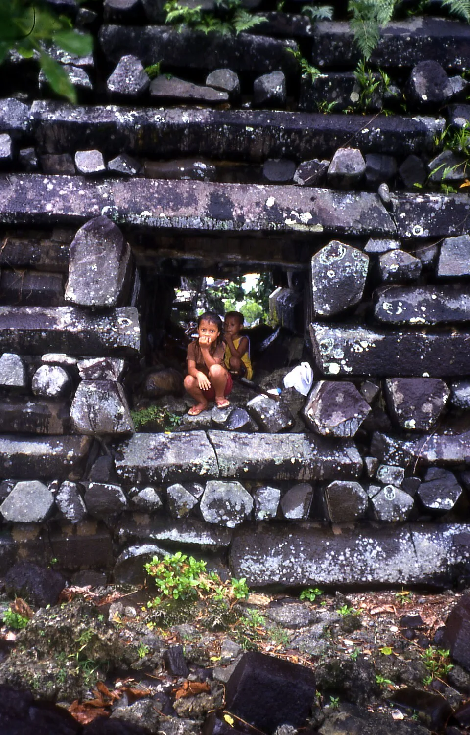 Kids in Passage Through Basalt Wall, Nan Madol, Pohnpei
